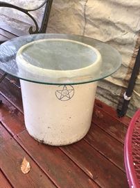 12 gallon crock being used as a glass top side table