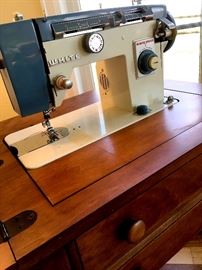 Here's A Nice White Sewing machine w/Cabinet For You...