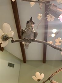Close-up of birds on cherry blossom chandelier