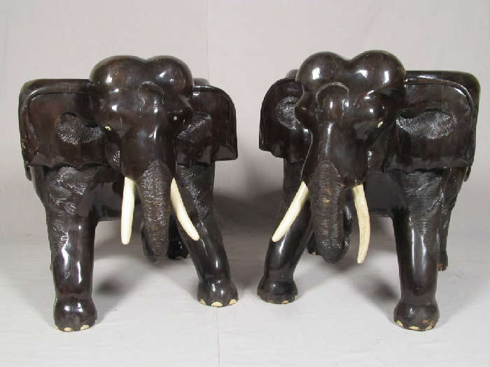 Pair of amazing hand carved elephant chairs out of teak or another similar Asian hardwood. Great detail, very heavy. Believed to be of Southeast Asian provenance.