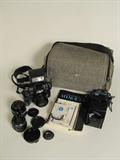 Minolta 7000 Maxxum manual camera with 2 extra lenses, filter, detachable flash, strap and camera bag.