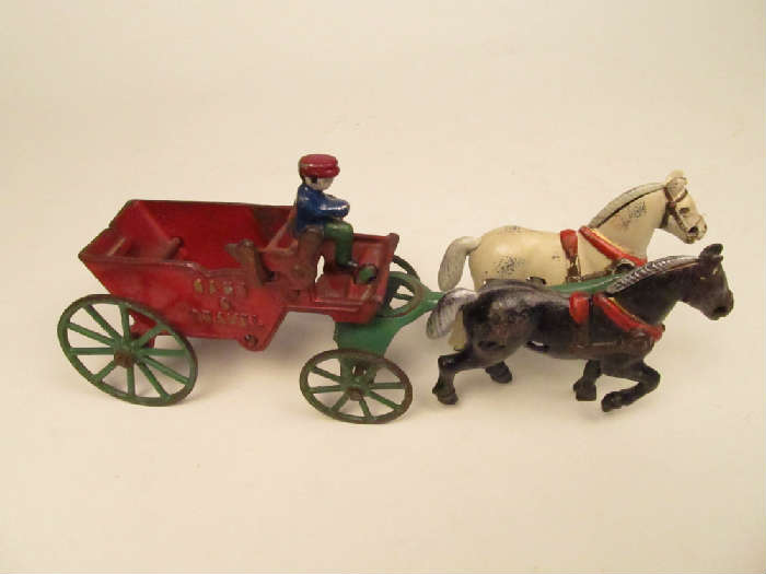 Kenton (?) cast iron "Sand & Gravel" wagon with driver and drawn by black and white horse tandem.