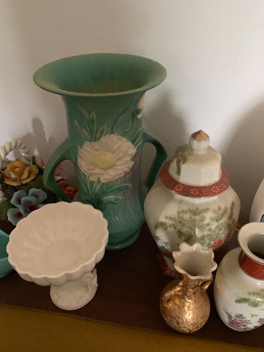 Roseville pottery and porcelain pieces.
