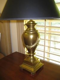 One of a pair of brass lamps with black shades