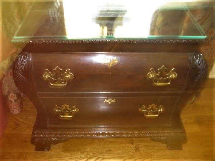 One of a pair of bombe chest nightstands