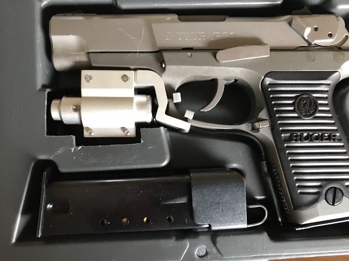 Ruger P89, 9mm with lazer sights and original case and paperwork 