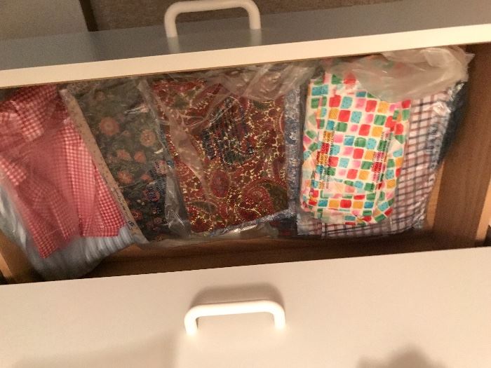 Many drawers of material
