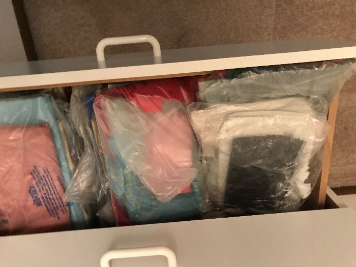 Many drawers of material