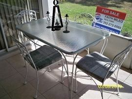 Wrought iron Table with 4 chairs and glass top