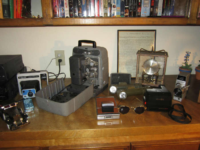 Bell & Howell Projector, Movie Camera, Olive Kel-lite Flashlight, Kundo Clock, Polaroid SX-70 Land Camera