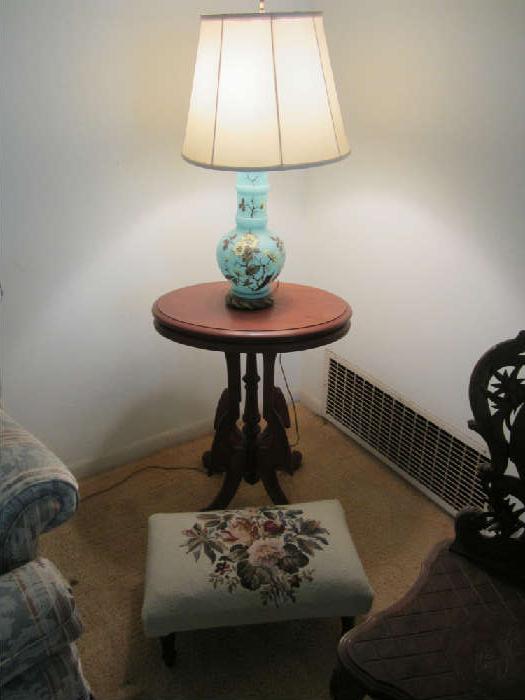 Sweet small Eastlake Table with lamp and needlepointed small ottoman