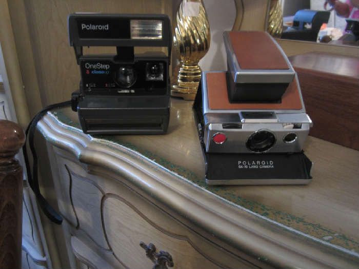 Pictured is the Polaroid SX 70 Camera and Polaroid One Step.  Several other cameras as well