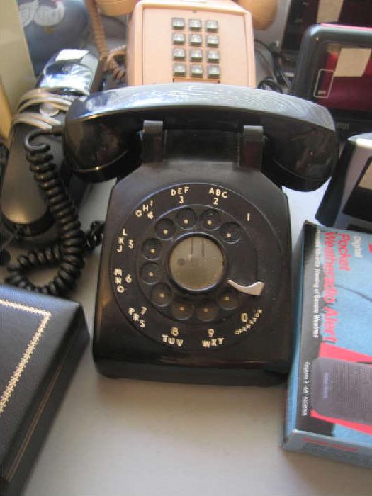 Black Rotary phone.  Also have red and a cream rotary desk phone and one black rotary wall phone