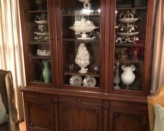 Mahogany china cabinet with pullout serving table.  Full of 1950's  Capodimonte and other Italian vintage pottery pieces