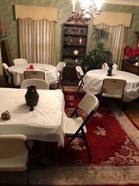 oriental rugs and folding chairs