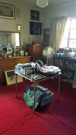 Room View - Dresser, chest of drawers, fan, bookshelf, books.