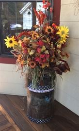 Large floral arrangement and painted milk can