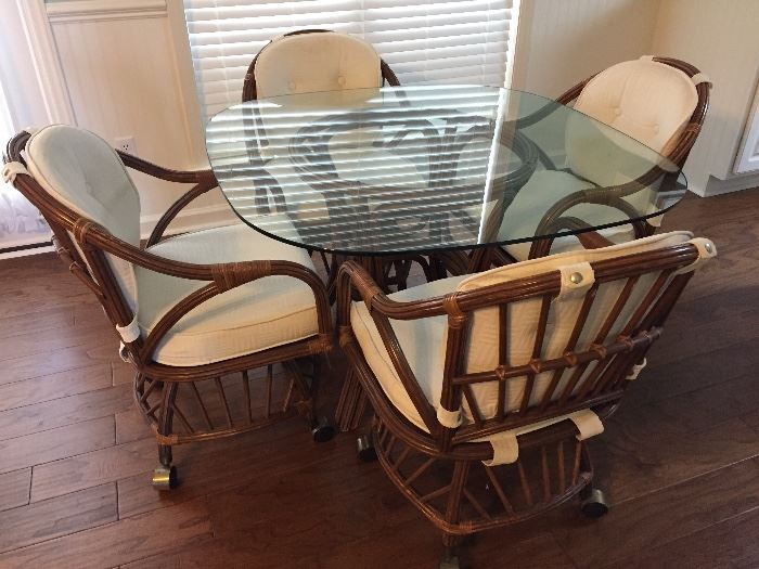 Glass Top Dining Table and Wheeled Chairs