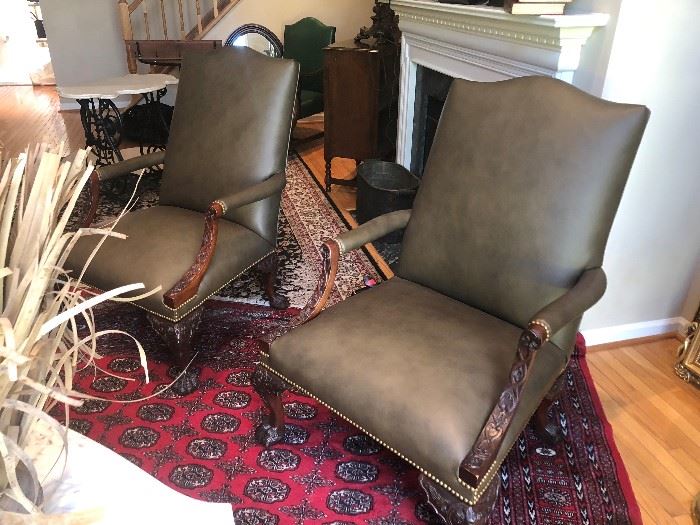 PAIR OF HENREDON LEATHER CHAIRS WITH CARVED WOOD DETAILING ON ARMS AND LEGS