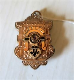 Antique pendant with locket on backside.