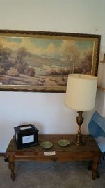 coffee table, lamp, wall hanging