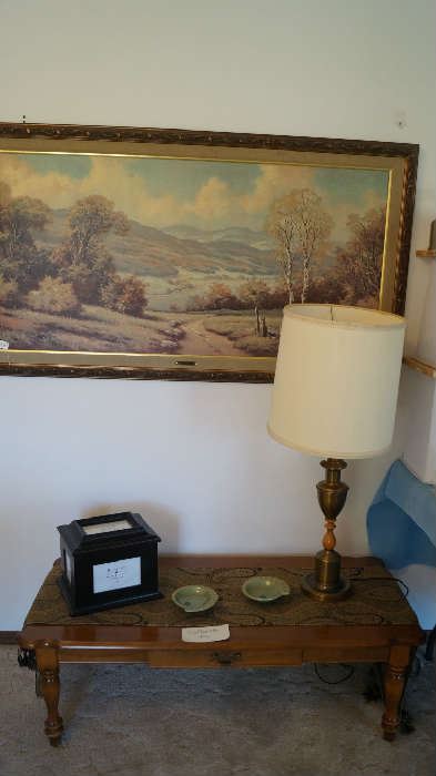 coffee table, lamp, wall hanging