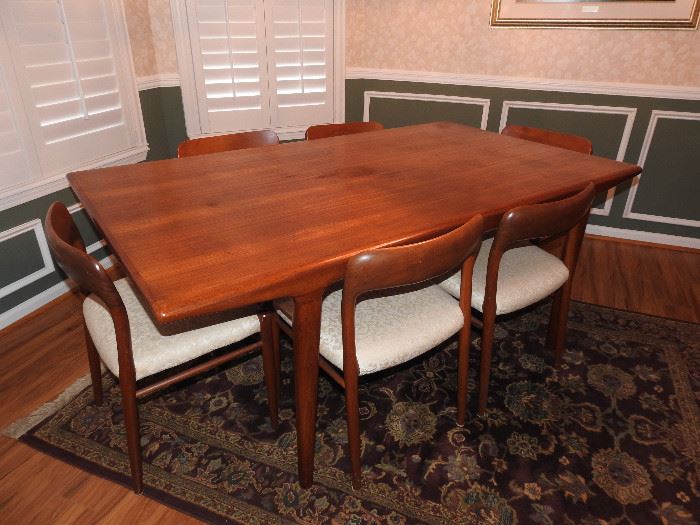 Over eight (8) feet (103") long when extended with the leaves. 71 inches long when not extended. 41" wide and 28" tall.