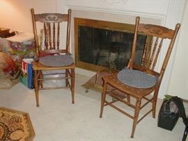 Two pressed back antique chairs