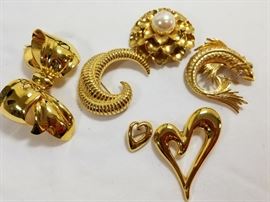 Collection of vintage Monet costume jewelry pins https://ctbids.com/#!/description/share/132068