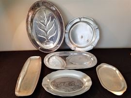 collection of 6 stainless steel and pewter platters https://ctbids.com/#!/description/share/131959