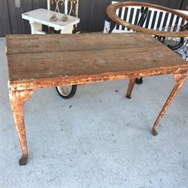 Vintage farm table (made with wood top and vintage oven legs)