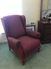 One of two pristine wing back chairs