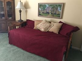 Trundle bed.  There are several sets of bedding .