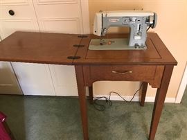 Sewing machine and cabinet