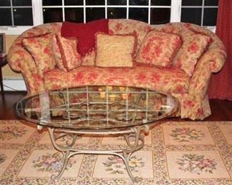 Sofa, Glass & Metal Coffee Table and Floral Rug