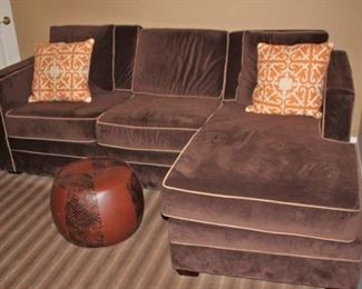 Small Brown Sectional with Accent Pillows and Small Ottoman