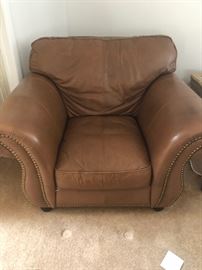 brown leather chair with railheads