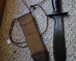 WWII knife (has some damage in handle) and scabbard.