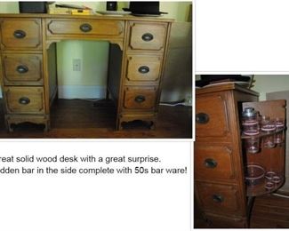 This desk is doubly wonderful! solid wood desk with a Bonus - a Bar built into the side with original bar ware