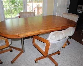 Table, leaf and 4 rolling chairs