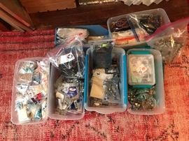 Bins of jewelry, jewelry pieces, pins