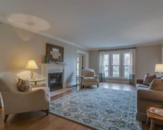 club chairs, large area rug, end table, lighting, accessories, sleeper sofa