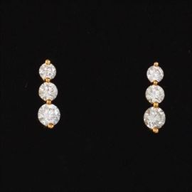 A Pair of Triple Diamond Earrings 