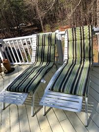 Two lounging chairs with cushions