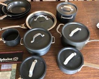 A collection of Calphalon and Commercial cookware