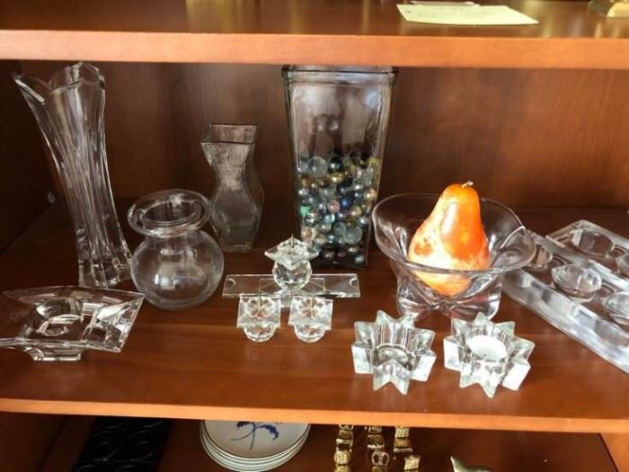 A collection of glass candle holders for votives