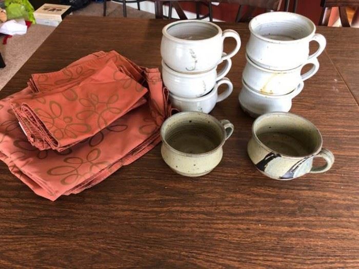 A collection of stoneware wide open mouth mugs