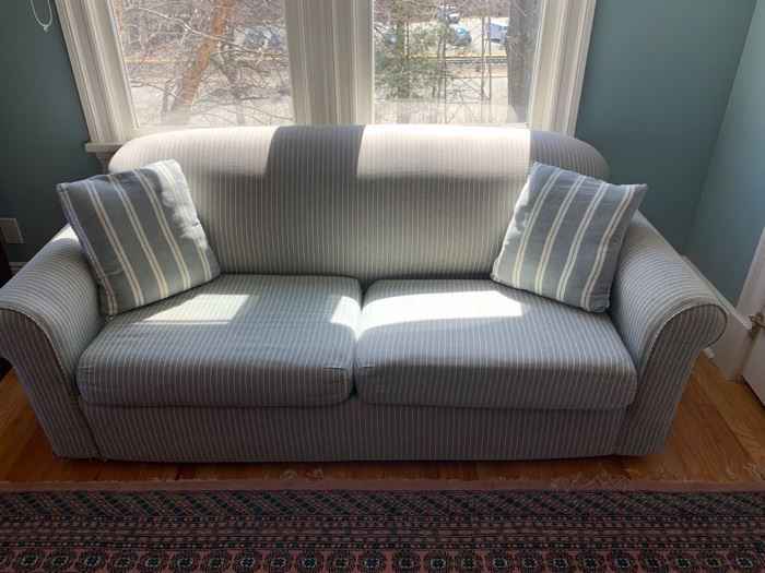 77. Grey and White Pinstripe Sleeper Sofa (80" x 34" x 32") (as is)