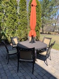 138. Agio Aluminum Round Dining Table (60") and 6 Arm Chairs (28" x 24" x 38")w/ Umbrella (10')