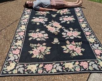 Syd is showing how large this beautiful needlepoint rug is!!!  It is amazing!  She is too!!!